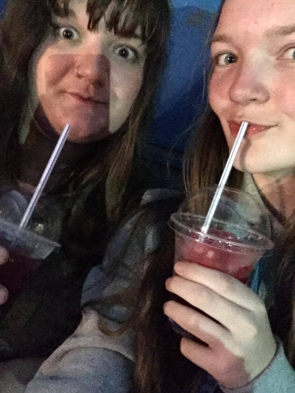 Emma Geraghty and her sister drinking through straws